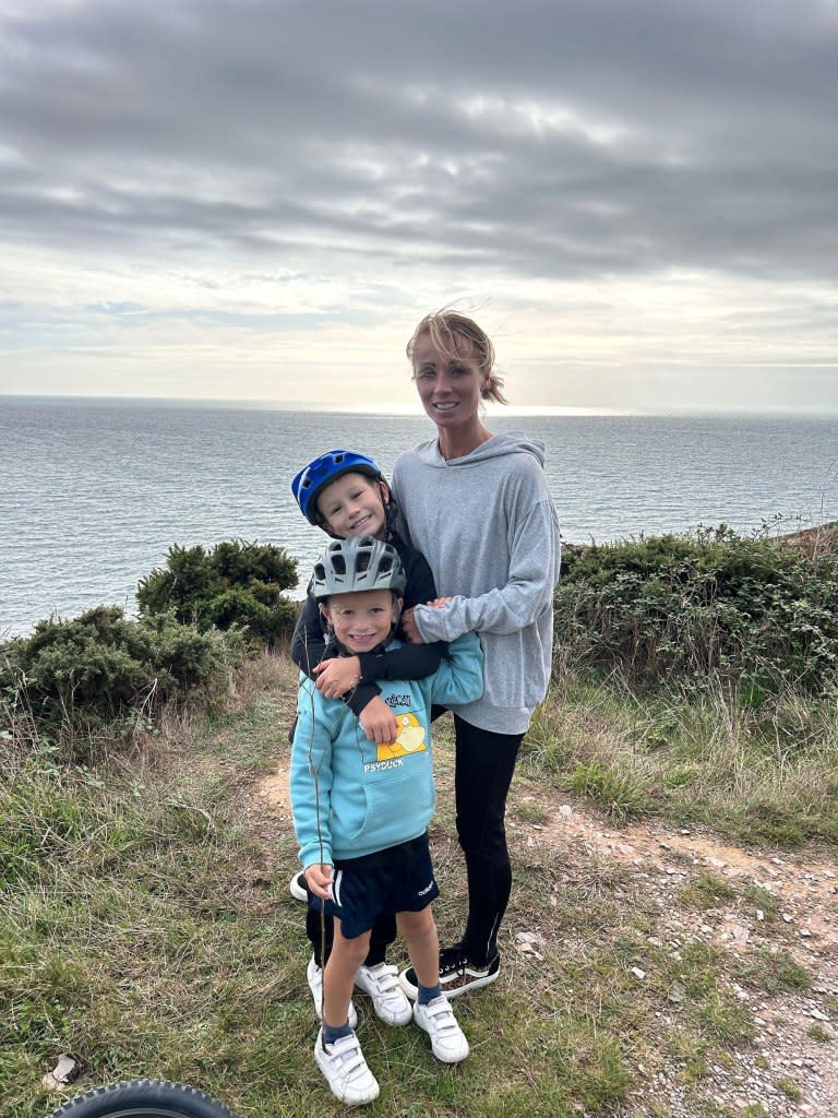 Fiona Donald, 41, started experiencing pain in her neck the day after giving birth to her son, Ralph, who is now 6. Also pictured: her son Rory. Fiona Donald