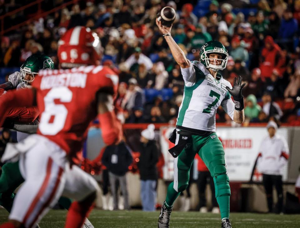 Saskatchewan Roughriders quarterback Trevor Harris (7) throws the ball as Calgary Stampeders' Demerio Houston (6) rushes in during second half CFL football action against the Calgary Stampeders in Calgary, Friday, Sept. 20, 2024.