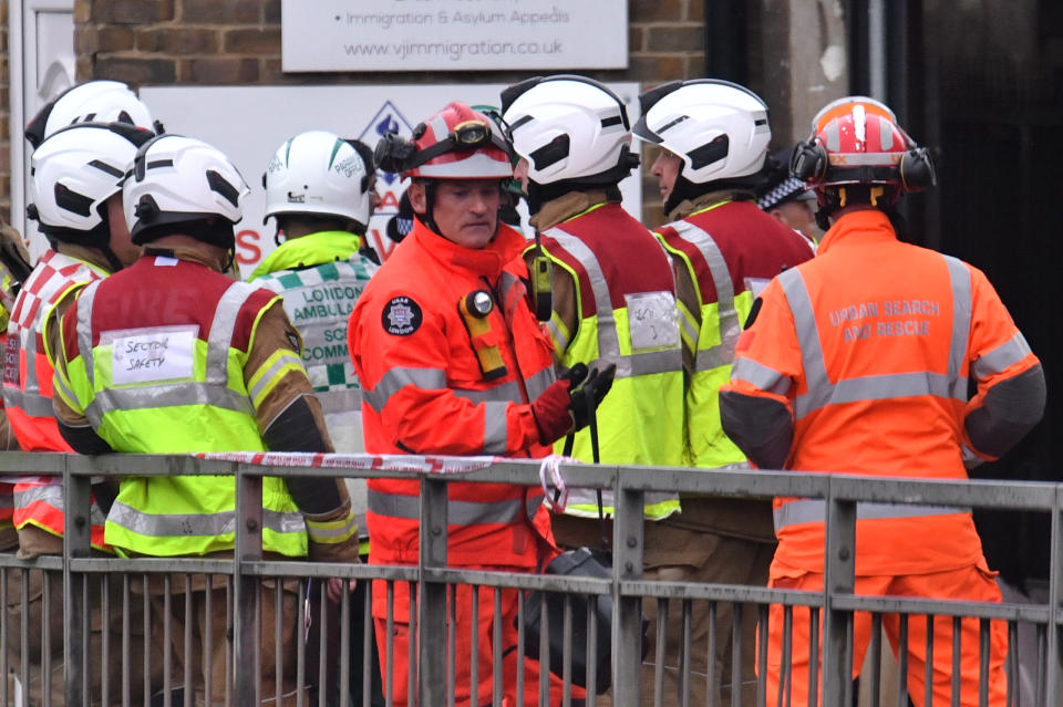 Emergency services at the scene of a suspected gas explosion on King Street in Ealing, west London. Rescuers are involved in a "complex" search for anyone who may still be inside the collapsed building. (Photo by Dominic Lipinski/PA Images via Getty Images)