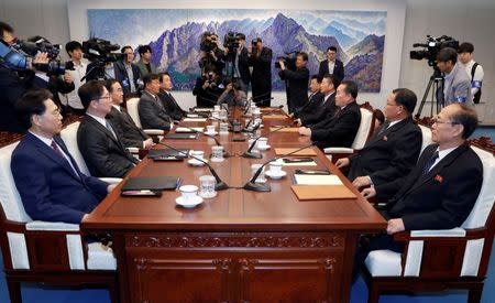 North Korea's Ri Son Gwon, chairman of the Committee for the Peaceful Reunification of the Country, talks with South Korean Unification Minister Cho Myoung-gyon during their meeting at the truce village of Panmunjom inside demilitarized zone, South Korea, October 15, 2018. Korea Pool/Yonhap via REUTERS