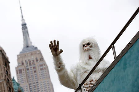 FILE PHOTO: An actor dressed as a 'Yeti' waves from a tour bus during a promotional event for Travel Channel's "Expedition Unknown: Hunt for the Yeti" in Manhattan, New York City, U.S. on October 4, 2016. REUTERS/Brendan McDermid/File Photo