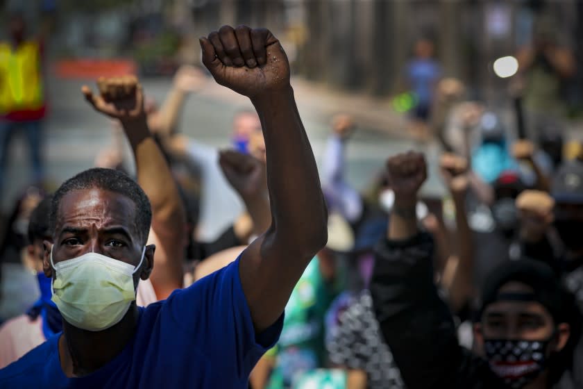 ANAHEIM, CA - JUNE 03: Protestors rally on the steps Anaheim City Hall steps against last week's in-custody death of George Floyd in Minneapolis City Hall on Wednesday, June 3, 2020 in Anaheim, CA. (Irfan Khan / Los Angeles Times)