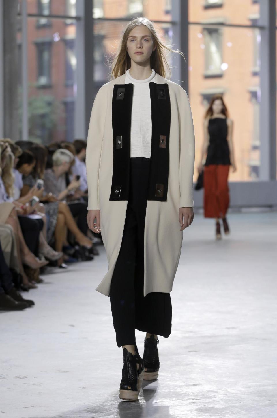 The Proenza Schouler Spring 2014 collection is modeled during Fashion Week in New York, Wednesday, Sept. 11, 2013. (AP Photo/Seth Wenig)