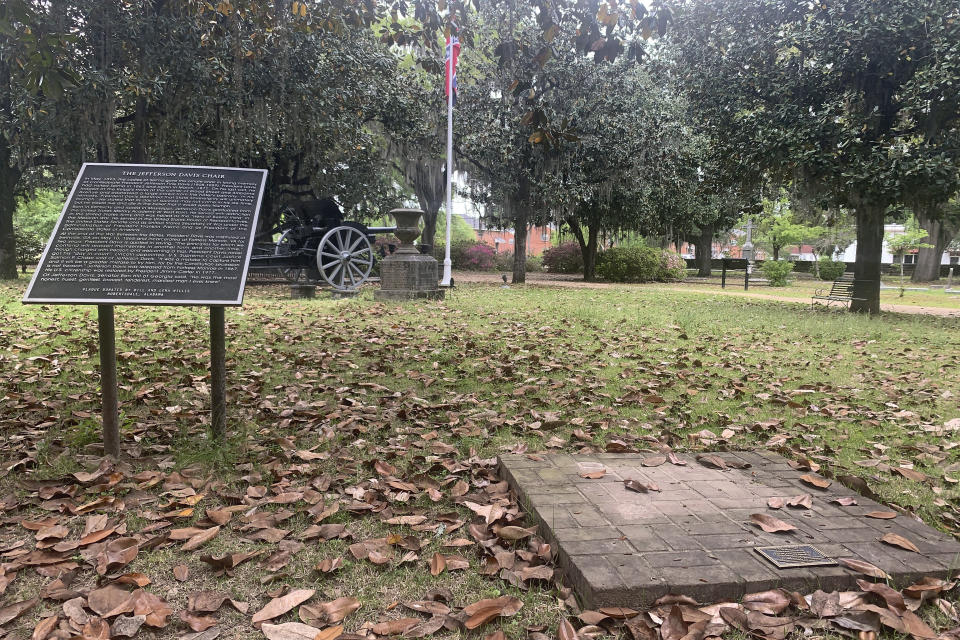 A brick base sits empty Tuesday, April 13, 2021, where chair carved out of limestone honoring Confederate President Jefferson Davis was stolen from Confederate Memorial Circle, a private section of Live Oak Cemetery in Selma, Ala. Police recovered the chair in New Orleans. (AP Photo/Kim Chandler)