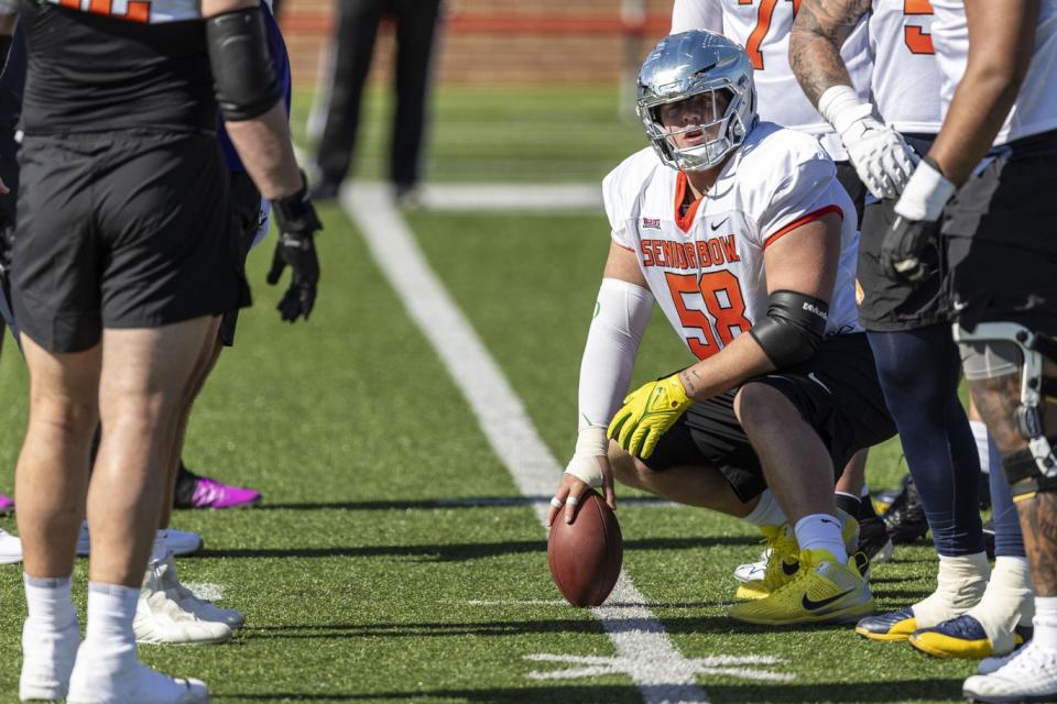 Jan 30, 2024; Mobile, AL, USA; National offensive lineman Jackson Powers-Johnson of Oregon (58) sets up a play during practice for the National team at Hancock Whitney Stadium. Mandatory Credit: Vasha Hunt-USA TODAY Sports