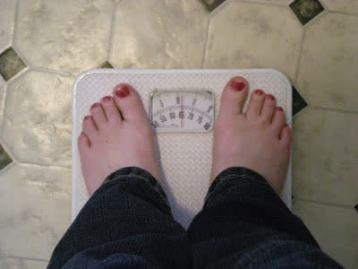 woman on weight scale