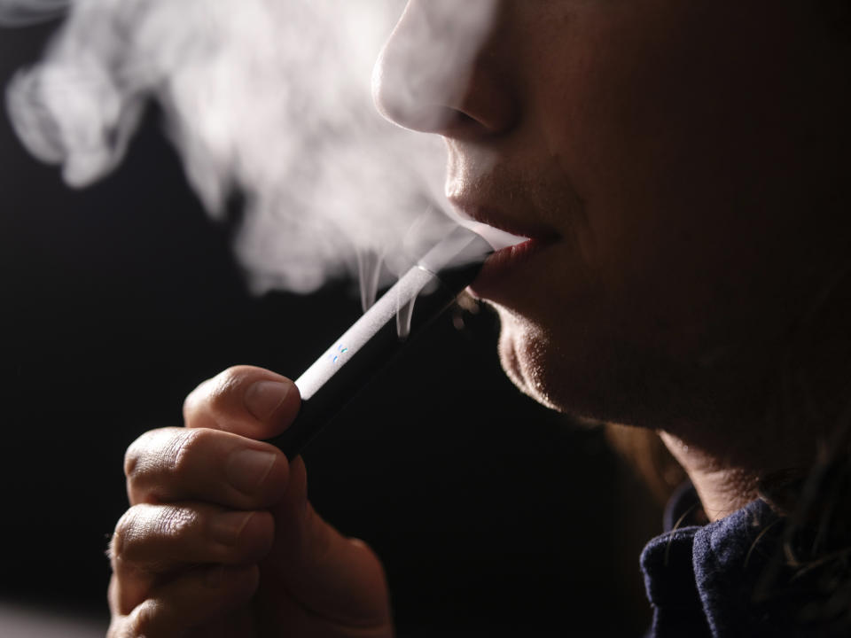 A person uses a Pax Labs Inc. Era cannabis vaporizer in this arranged photograph taken in Berkeley, California, U.S., on Tuesday, Oct. 23, 2018. Pax Labs, a San Francisco-based startup, raised $20 million from investors, Chief Executive Officer Bharat Vasan said on Monday. Photographer: Cayce Clifford/Bloomberg via Getty Images