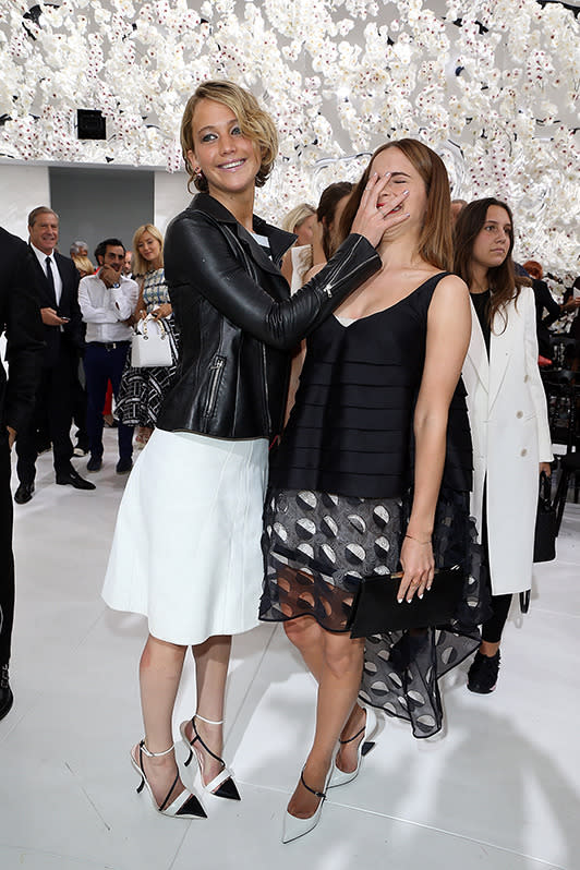 Jennifer Lawrence face palms Emma Watson at the Dior couture show.