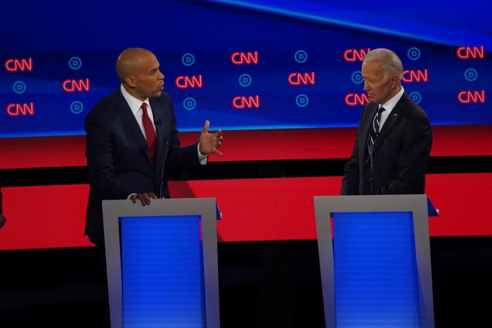 Democratic presidential candidates Sen. Cory Booker and former Vice President Joe Biden at a Democratic presidential debates in Detroit on July 31, 2019.