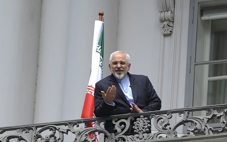 Iranian Foreign Minister Javad Zarif talks to media from a balcony of the Palais Coburg Hotel, the venue of the nuclear talks in Vienna, on July 2, 2015