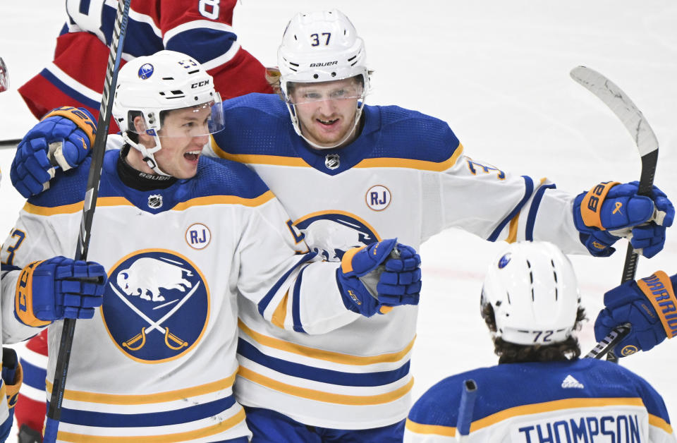 Buffalo Sabres' Jeff Skinner (53) celebrates with Casey Mittelstadt (37) and Tage Thompson (53) after scoring against the Montreal Canadiens during the second period of an NHL hockey game Thursday, Jan. 4, 2024, in Montreal. (Graham Hughes/The Canadian Press via AP)