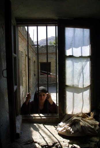 File photo shows a Afghan woman prisoner in Kabul. In Afghanistan's deeply conservative society many inmates fear they could be murdered by their families for reasons of "honour" after they are released from prison