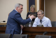 House Majority Leader Kevin McCarthy, R-Calif., left, talks with Rep. Jim Jordan, R-Ohio, before the House Judiciary Committee questions Google CEO Sundar Pichai about the internet giant's privacy security and data collection, on Capitol Hill in Washington, Tuesday, Dec. 11, 2018. McCarthy made an opening statement before Pichai appeared. (AP Photo/J. Scott Applewhite)