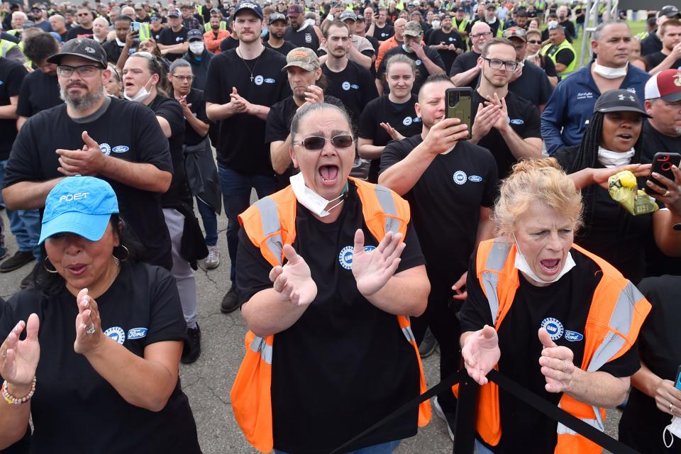 Workers of the Ford Motor Co. cheer during a news conference, Thursday, June 2, 2022, in Avon Lake, Ohio. Ford announced it will add 6,200 factory jobs in Michigan, Missouri and Ohio