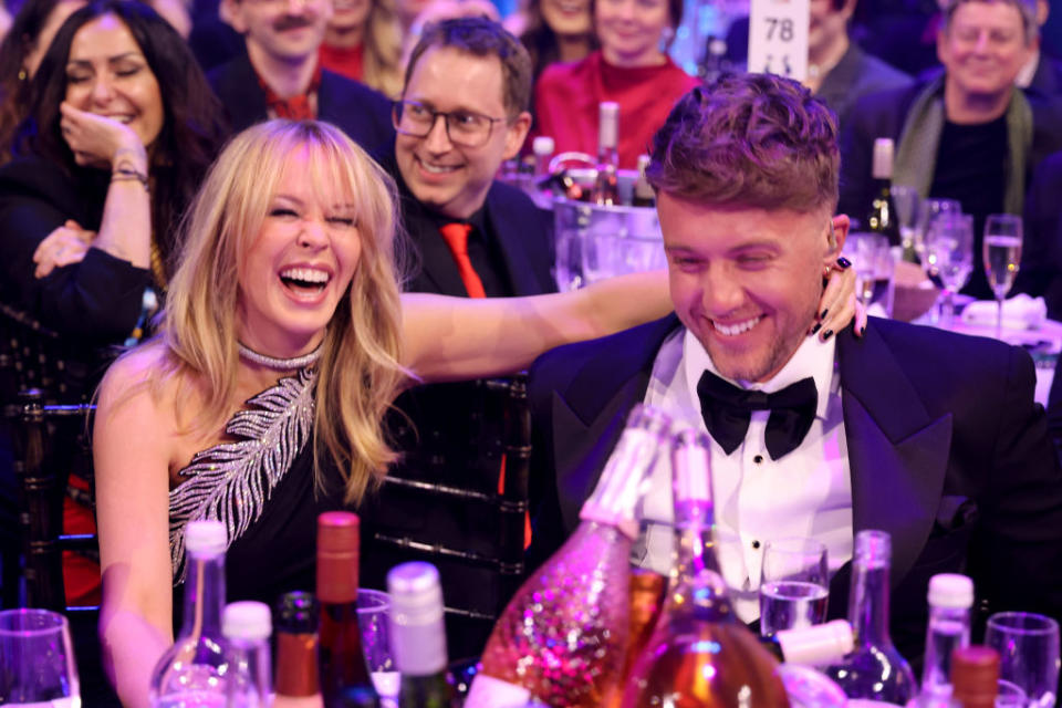 LONDON, ENGLAND - MARCH 02: Kylie Minogue and Roman Kemp during the BRIT Awards 2024 at The O2 Arena on March 02, 2024 in London, England. (Photo by JMEnternational/Getty Images)