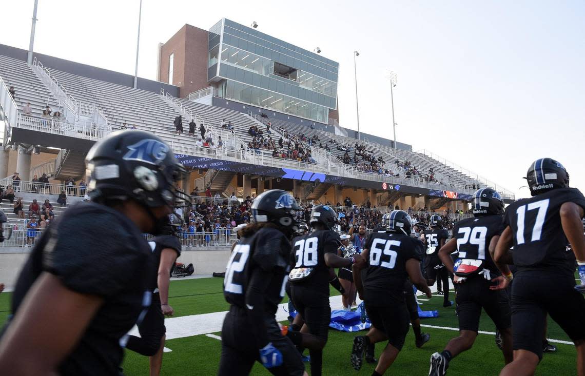 The North Crowley football team runs onto the field to play their first football game in a new stadium against Lovejoy Thursday September 8, 2022 at Crowley ISD Stadium in Fort Worth, Texas. Special/Bob Haynes Bob Haynes/Special to the Star-Telegram