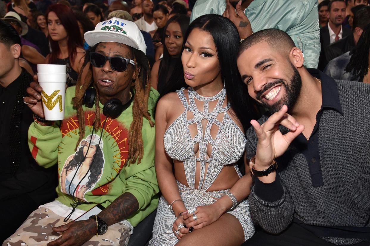 Lil Wayne, Nicki Minaj, and Drake sitting in the audience at the 2017 Billboard Music Awards.