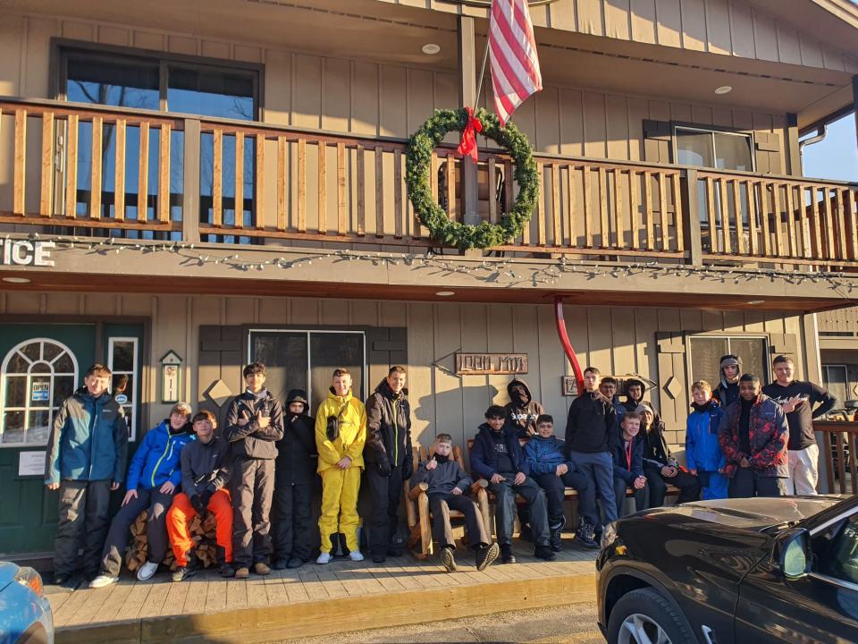 image of the students lined up in front of their lodge in New Hampshire