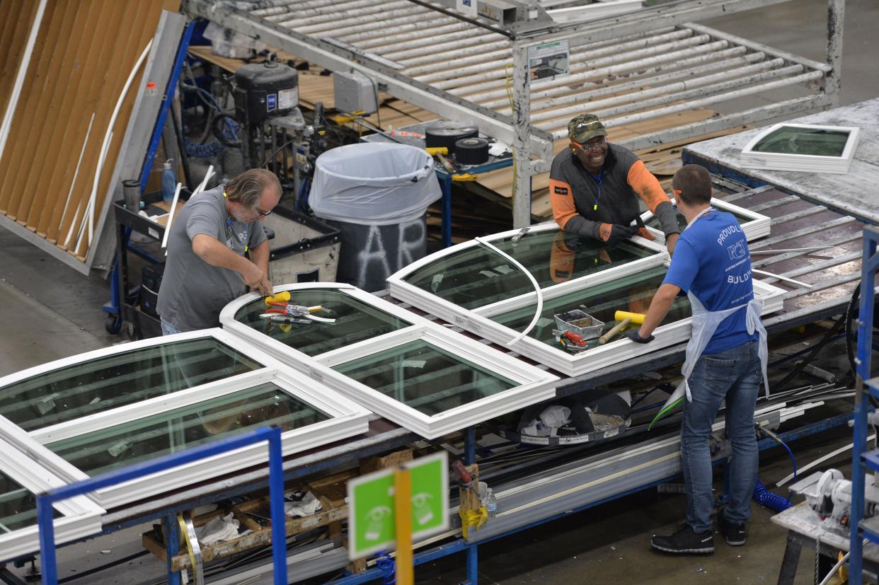 PGT employees assemble custom windows on the production floor of the manufacturing facility in Venice on Nov. 16, 2023.