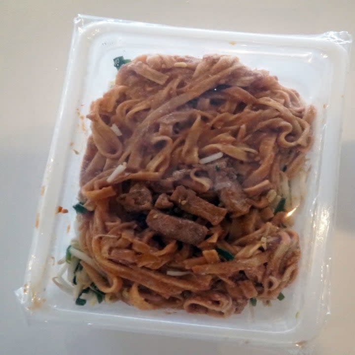 Frozen vegetable pad Thai in its container.