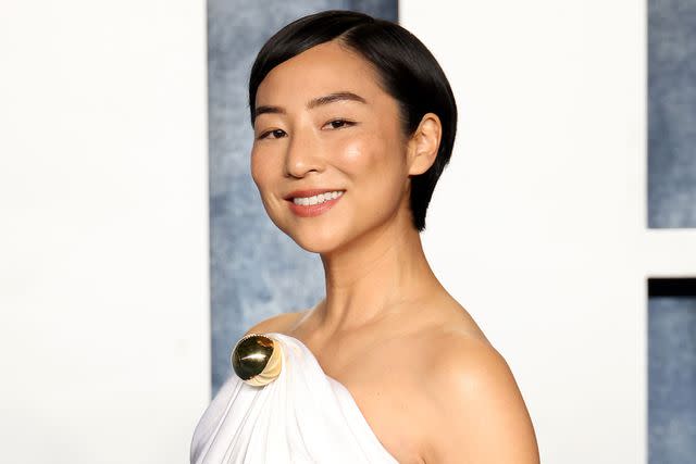 <p>Daniele Venturelli/Getty Images</p> Greta Lee attends the 2023 Vanity Fair Oscar Party in 2023.