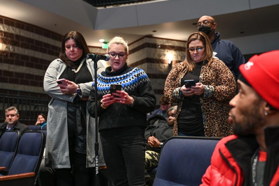Hillary Henderson, center, along with other former Board of Education members speak during the public comment portion of an East Lansing Board of Education special meeting on Monday, Jan. 30, 2023, at East Lansing High School. The meeting was held to discuss a school safety plan.