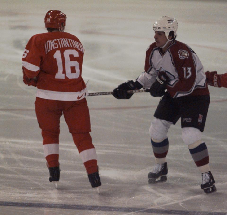 Vladimir Konstantinov knocks away the stick of Colorado Avalanche's Valeri Kamensky during Game 1 of the Western Conference finals in Denver, May 15, 1997.