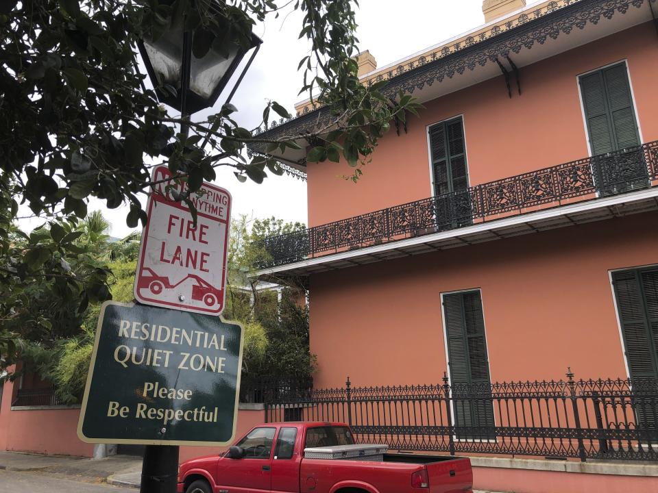 In this Wednesday, May 20, 2020 photo, a sign on a lamp post in New Orleans’ French Quarter, reminds visitors that there are residences in the historic district that is best known for its restaurants and bars. Since the shutdown of many entertainment venues during the coronavirus pandemic, some French Quarter residents, while acknowledging the economic pain and suffering, say the lack of tourists has been a relief from the amplified noise of nightclubs and belligerent drunks. (AP Photo/Kevin McGill)