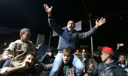 Palestinians react during a protest against U.S. President Donald Trump's decision to recognise Jerusalem as Israel's capital, in Khan Younis in the southern Gaza Strip December 6, 2017. REUTERS/Ibraheem Abu Mustafa