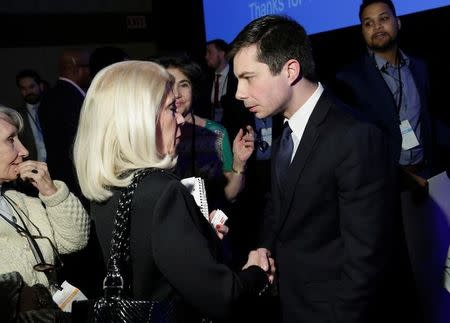 Pete Buttigieg, Mayor of South Bend, Indiana and a candidate for Democratic National Committee Chairman, speaks to a supporter after a Democratic National Committee forum in Baltimore, Maryland, U.S., February 11, 2017. REUTERS/Joshua Roberts