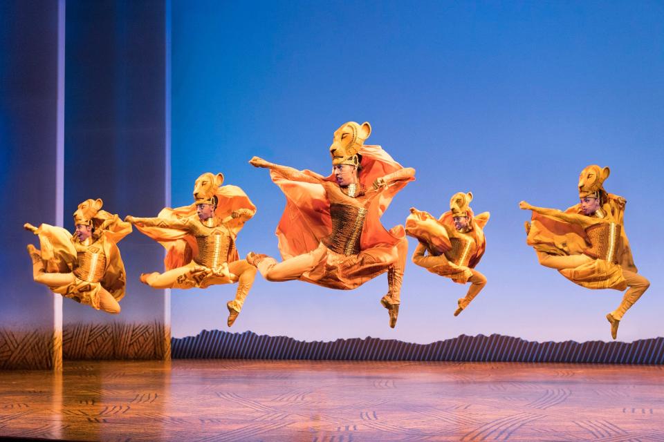 Cast members of the North American tour of Disney's "The Lion King" dance as lionesses.
