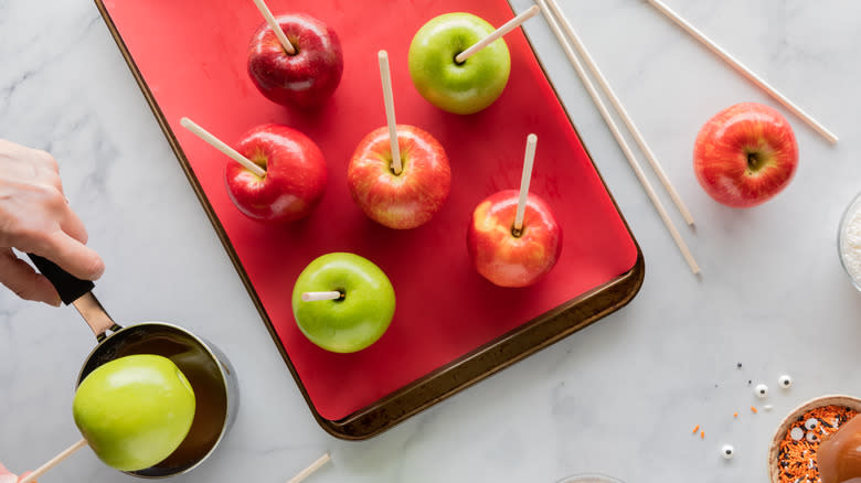 Apples with sticks inserted