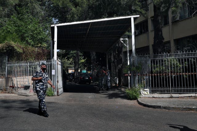 A Lebanese police officer stands guard in front of the Justice Palace in Beirut, Lebanon