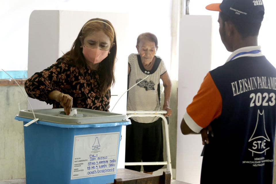 A woman casts her ballot at a polling station during the parliamentary election in Dili, East Timor, Sunday, May 21, 2023. East Timor on Sunday held its fifth parliamentary election since gaining its independence in 2002. (AP Photo/Lorenio L.Pereira)