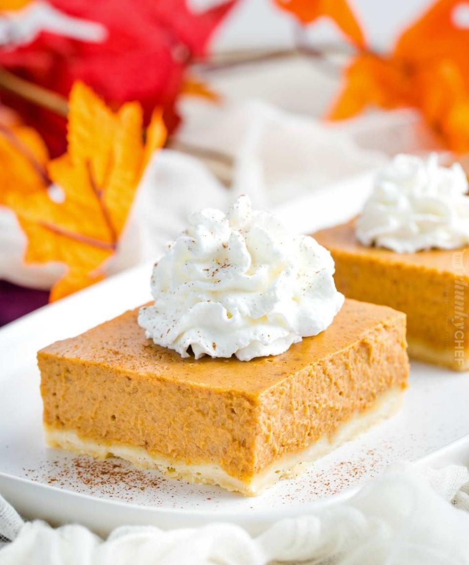 <p>For some reason, there's something so charming about a pumpkin pie bar. (Though we'll never say no to a classic slice, either.) A shortbread crust and a dollop of whipped cream makes this recipe extra irresistible. <br></p><p><strong>Get the recipe at <a href="https://www.thechunkychef.com/pumpkin-pie-bars/" rel="nofollow noopener" target="_blank" data-ylk="slk:The Chunky Chef;elm:context_link;itc:0;sec:content-canvas" class="link ">The Chunky Chef</a>.</strong> </p>