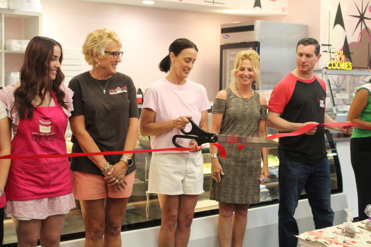 Bake My Day held a ribbon cutting for the re-opening of their business on Friday afternoon at 803 N. Lexington-Springmill Rd in Ontario. Owner Lisa Bihl (middle) cuts the ribbon.
