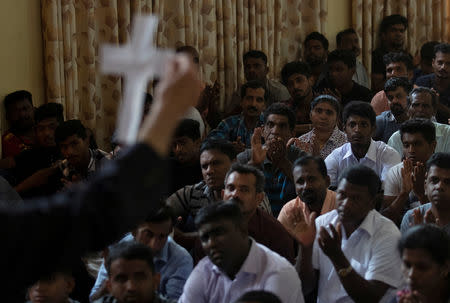 Members of Zion Church, which was bombed on Easter Sunday, pray at a community hall in Batticaloa, Sri Lanka, May 5, 2019. REUTERS/Danish Siddiqui