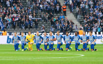 Hertha's players kneeling with linked arms in collective protest against discrimination during the German Bundesliga soccer match between Hertha BSC and FC Schalke 04 in Berlin, Germany, 14 October 2017. (Photo by Annegret Hilse/picture alliance via Getty Images)