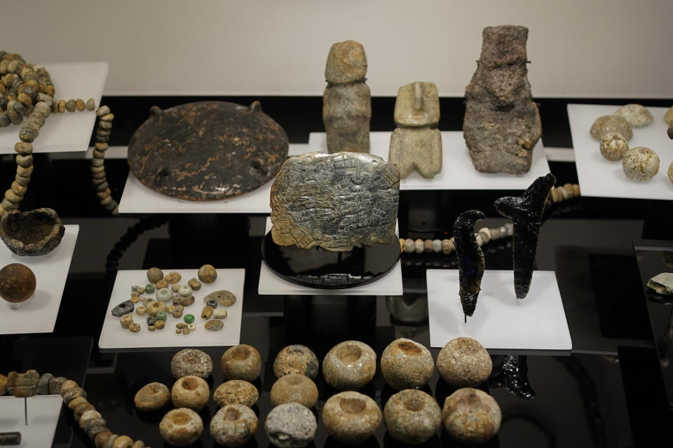 Archaeological objects discovered in the ruins of the Templo Mayor in 1978, are on display as part of the “Coyolxauhqui: The star, the goddess, the discovery” exhibit at the Museum of Templo Mayor, in Mexico City, Wednesday, March 29, 2023. The exhibit marks the 45th anniversary of the discovery of a monolith depicting Coyolxauhqui, the Mexica lunar goddess. (AP Photo/Eduardo Verdugo)