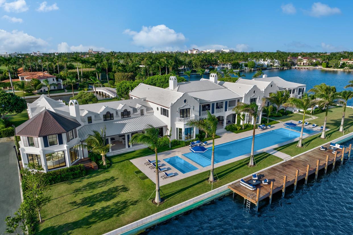 With a 98-foot swimming pool, a renovated-and-expanded house at 10 Tarpon Isle on a private island in Palm Beach is under contract with an asking price of $187.5 million. The tennis pavilion is at the far left, while the guest wing is at the far right.