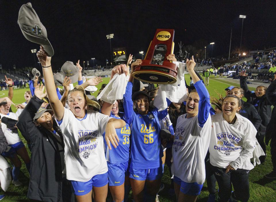 UCLA players celebrates after defeating North Carolina to win the NCAA women's soccer tournament final in Cary, N.C., Monday, Dec. 5, 2022. (AP Photo/Ben McKeown)