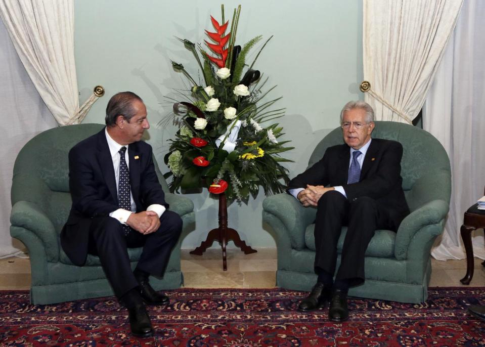 Maltese Prime Minister Lawrence Gonzi, left, and Italian Premier Mario Monti talk during a bilateral meeting at a Mediterranean summit of southern European and North African countries, in Valletta, Malta, Friday, Oct. 5, 2012. The Malta summit of five European and five African nations is expected to focus on fighting terrorism and lawlessness in North African as well as France's push for a military intervention in Mali, where Islamist rebels have taken control in the north. (AP Photo/Andrew Medichini)