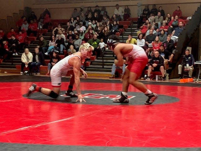 William Penn's Dan Sinclair (left) and Smyrna's Tyree Heath face off in a 144-pound match Sinclair won 11-4 Monday night.