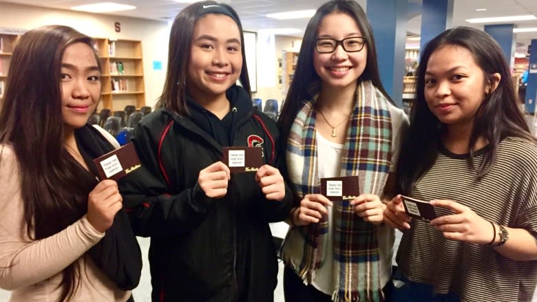 Winnipeg students hand out coffee cards to honour slain bus driver