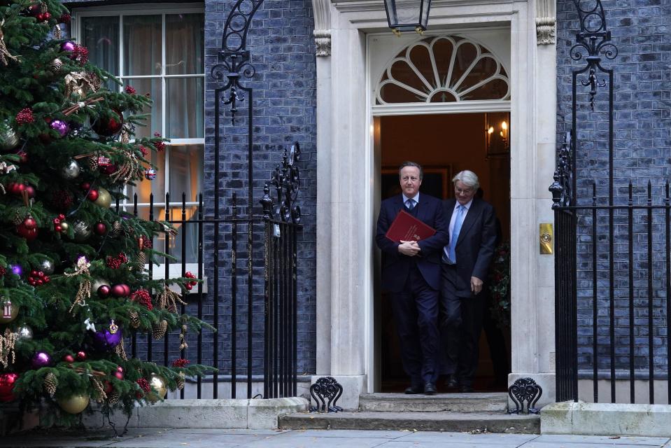 Foreign Secretary Lord David Cameron (left) and Minister of State for Development and Africa Andrew Mitchell leave 10 Downing Street (PA)