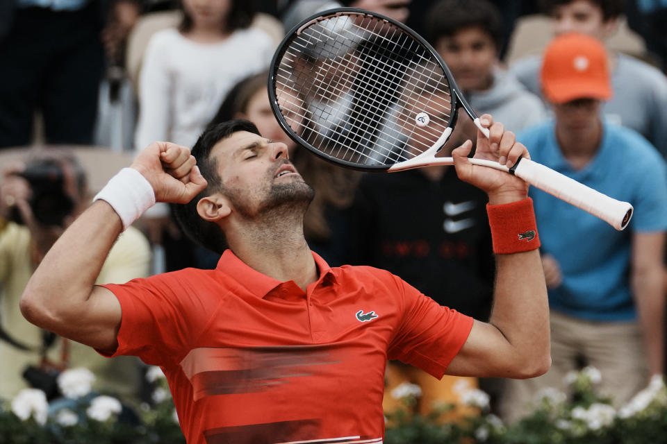 Serbia's Novak Djokovic reacts as he defeats Slovakia's Alex Molcan during their second round match of the French Open tennis tournament at the Roland Garros stadium Wednesday, May 25, 2022 in Paris. Djokovic won 6-2, 6-3, 7-6 (7-4). (AP Photo/Thibault Camus)