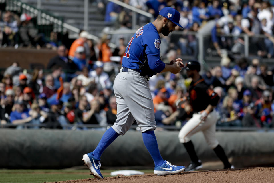 San Francisco Giants' Brandon Belt, left, rounds the bases after a two-run home run off Chicago Cubs starting pitcher Tyler Chatwood during the first inning of a spring baseball game in Scottsdale, Ariz., Sunday, Feb. 24, 2019. (AP Photo/Chris Carlson)