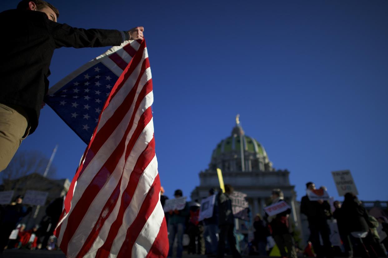 Protesters demonstrate outside the Pennsylvania Capitol in Harrisburg in December 2016. (Photo: Mark Makela via Getty Images)