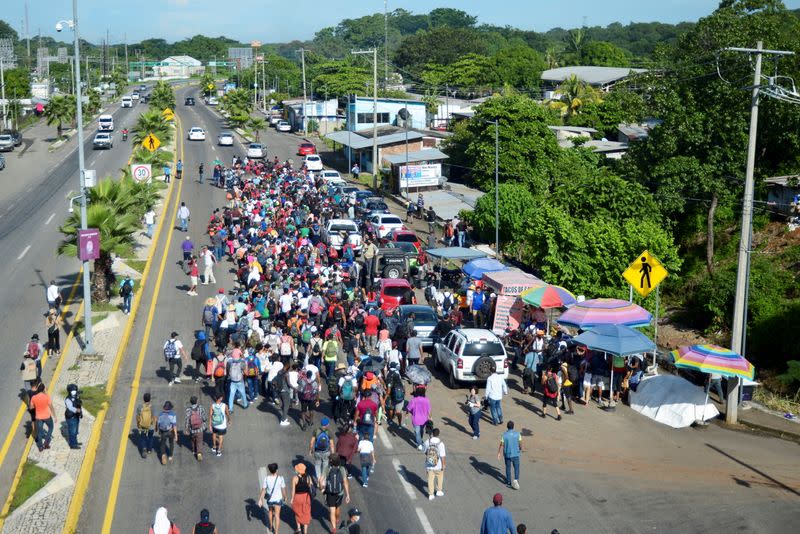 Migrants walk in a caravan toward U.S., in Tapachula