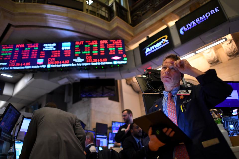 Traders work during the closing bell at the New York Stock Exchange (NYSE) on February 24, 2020 at Wall Street in New York City. - Wall Street stocks finished with steep losses February 24, 2020, joining a global rout on mounting worries that the coronavirus will derail economic growth. At the closing bell, the benchmark Dow Jones Industrial Average was down 3.6 percent at 27,962.91, a drop of more than 1,000 points and the biggest loss in a session in more than two years. (Photo by Johannes EISELE / AFP) (Photo by JOHANNES EISELE/AFP via Getty Images)